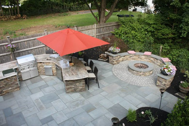 Design ideas for a modern backyard patio in Boston with an outdoor kitchen.