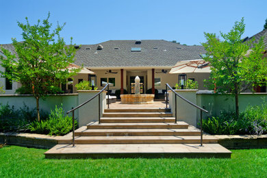 Inspiration for a huge mediterranean backyard tile patio fountain remodel in San Francisco with a roof extension