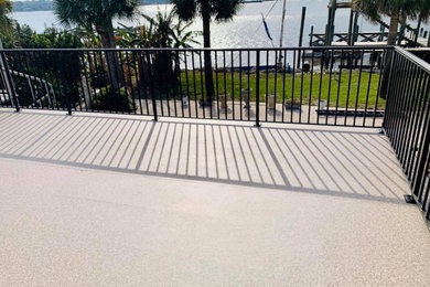 Mid-sized minimalist rooftop privacy deck photo in Jacksonville with no cover