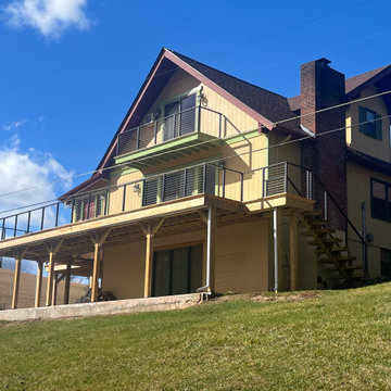 A Mountain Home Deck Elevated with Black Cable Railing