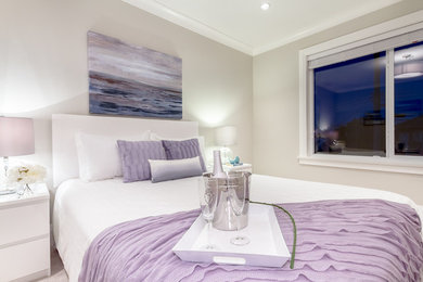 Example of a minimalist bedroom design in Vancouver