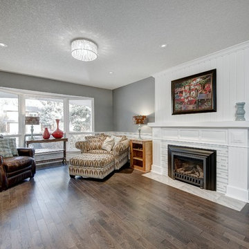 Family room fireplace with new gas insert and craftsman facade.