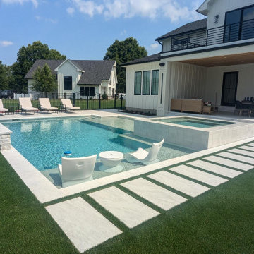 Lewes, DE - Modern, Clean Line Pool with Large Tanning Ledge & Elevated Spa