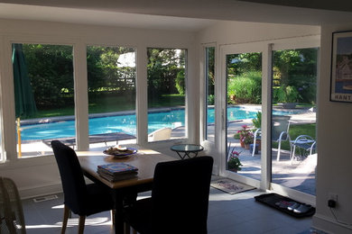 This is an example of a small traditional sunroom in Philadelphia with ceramic floors and a standard ceiling.