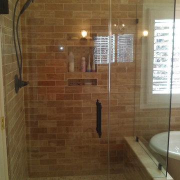 Frameless Shower Door with Earth Tones and Oil Rubbed Bronze Hardware