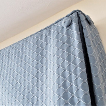 Box pleat valances enhanced with covered buttons in a quiet study