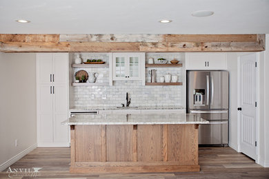 Inspiration for a transitional kitchen remodel in Salt Lake City with flat-panel cabinets and an island