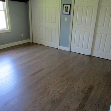 NISSEQUOGUE:  2 1/4" RED OAK W/ CUSTOM GREY BLEND STAIN + BONA TRAFFIC HD SATIN