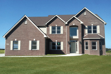 Mid-sized two-story brick exterior home idea in Indianapolis