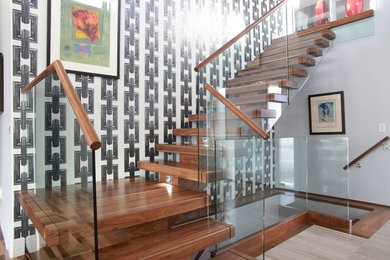 Inspiration for a mid-sized contemporary wooden l-shaped staircase remodel in Other with wooden risers