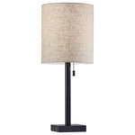Adesso - Liam Table Lamp - The Liam Table Lamp is an elegant style that highlights simple materials and a classic silhouette. A thick dark bronze finished metal pole supports a natural textured fabric shade. A tall cylinder shade is contrasted by a compact square shaped metal base. A simple pull chain turns the lamp on and off. Set this table lamp on your nightstand for a soft, transitional look.