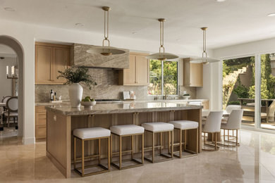 Kitchen - large transitional travertine floor kitchen idea in Orange County with a drop-in sink, shaker cabinets, light wood cabinets, brown backsplash, an island and brown countertops