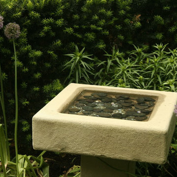 Custom Stone Bird Bath Surrounded by Allium