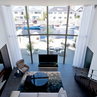 Inspiration for a large mediterranean formal open plan living room in Tokyo with white walls, slate flooring, no fireplace and a freestanding tv.