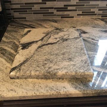 Silver Cloud Granite Countertops with Backsplash Tiles