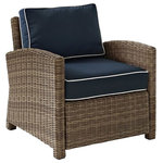 Crosley - Bradenton Outdoor Wicker Arm Chair With Navy Cushions - This finely crafted all-weather armchair makes a sophisticated addition to any outdoor space. Boasting a durable steel frame, this chair features an intricately woven wicker casing that exudes an elegant country charm. Complete with moisture-resistant cushions with weather-resistant cushion covers, the navy Bradenton Outdoor Wicker Arm Chair is super easy to assemble and maintain.
