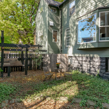 Bay window extends into the side yard, now with architectural trellis