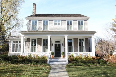 Mid-sized elegant beige two-story wood exterior home photo in Boston with a hip roof