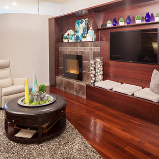 Inspiration for a mid-sized contemporary formal and enclosed medium tone wood floor living room remodel in Other with beige walls, a standard fireplace, a tile fireplace and a wall-mounted tv