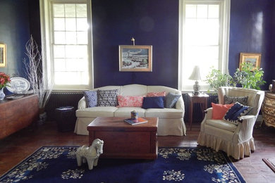 Farmhouse living room photo in Baltimore with blue walls