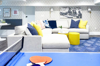 Example of a mid-sized beach style look-out laminate floor and wallpaper basement design in New York with white walls