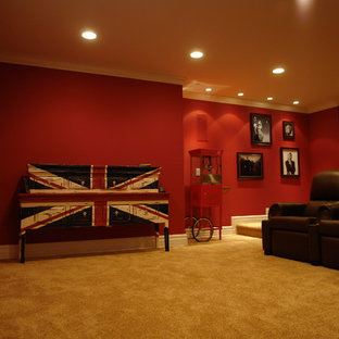 Photo of a large industrial open plan home cinema in Philadelphia with red walls, carpet, a projector screen and yellow floors.