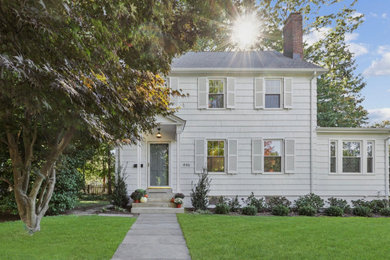 Inspiration for a timeless white two-story wood and clapboard exterior home remodel in New York with a shingle roof and a gray roof