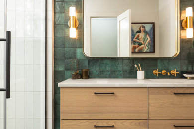 Inspiration for a mid-sized 1950s master green tile and ceramic tile porcelain tile, black floor and single-sink alcove shower remodel in DC Metro with flat-panel cabinets, brown cabinets, a two-piece toilet, white walls, an undermount sink, quartz countertops, a hinged shower door, gray countertops, a niche and a floating vanity