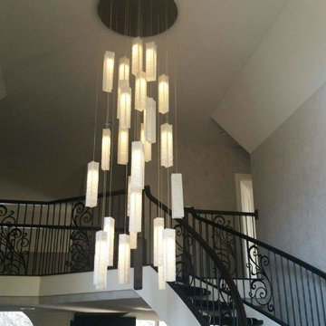 CONTEMPORARY STAIRCASE CHANDELIER, WHITE CANDLES CHANDELIER by GALILEE LIGHTING