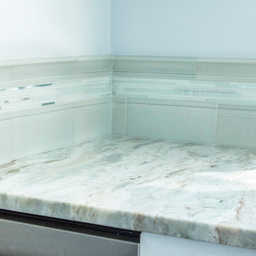 Glass and handmade tiles backsplash