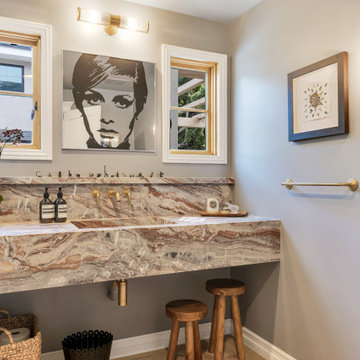 Statement Powder Room with Natural Stone Vanity & Brass Fixtures | Los Angeles