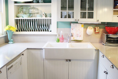 Kitchen - cottage kitchen idea in Austin with a farmhouse sink and white cabinets