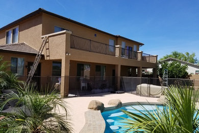 Example of a southwest home design design in Phoenix