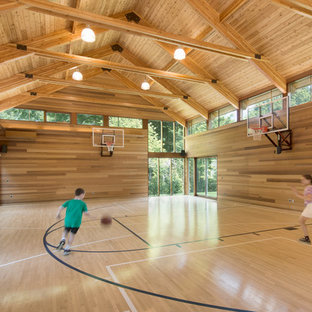 Design ideas for an expansive contemporary indoor sports court in Boston with beige walls and light hardwood flooring.