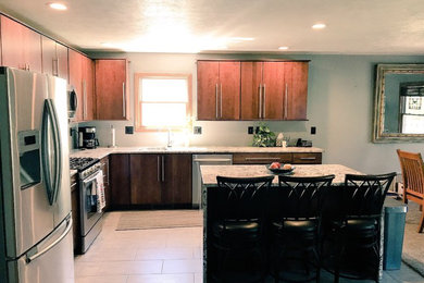 Inspiration for a mid-sized contemporary l-shaped ceramic tile and gray floor open concept kitchen remodel in Chicago with an undermount sink, flat-panel cabinets, medium tone wood cabinets, granite countertops, stainless steel appliances and an island