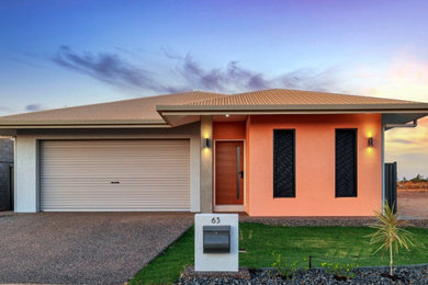 Design ideas for a mid-sized one-storey brick house exterior in Darwin.