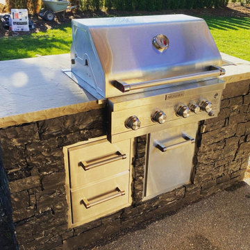 Outdoor kitchen and pass through gas fireplace