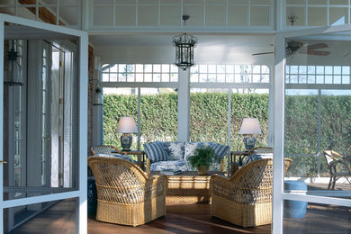 Inspiration for a large traditional front yard screened-in verandah in New York with decking and a roof extension.
