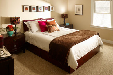 Example of a trendy carpeted bedroom design in New York with beige walls and no fireplace