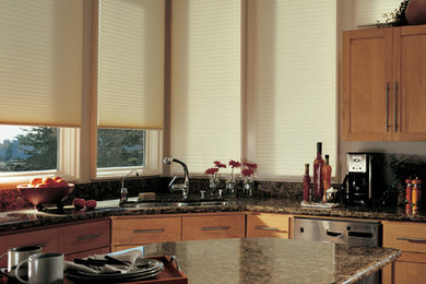 Example of a mid-sized minimalist porcelain tile kitchen design in St Louis