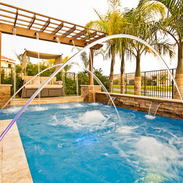 Roman/Geometric Pool With Pergola, Laminar Deck Jets and Spa in Boynton Beach