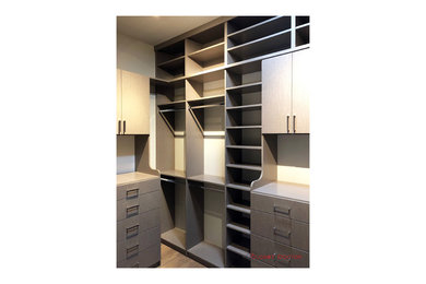 Example of a trendy closet design in Sacramento with flat-panel cabinets