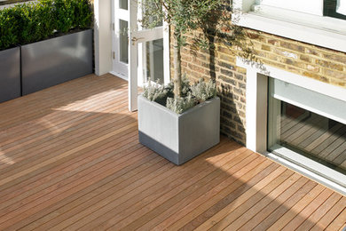 Design ideas for a large contemporary rooftop deck in London.