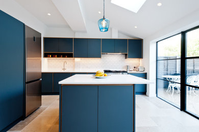 Inspiration for a medium sized contemporary l-shaped kitchen/diner in London with flat-panel cabinets, grey cabinets, quartz worktops, stainless steel appliances, ceramic flooring, an island, beige floors and white worktops.