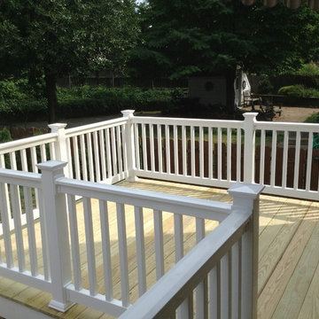 Small 12x12 Deck with walkway above basement stairs.