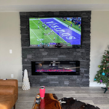 Electric Fireplace and TV Surround Using Iron Ore Stacked Stone