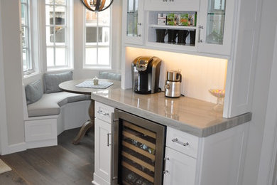 Home bar - small traditional single-wall dark wood floor home bar idea in Los Angeles with white cabinets, quartzite countertops, no sink and shaker cabinets