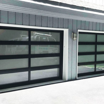 Two Contemporary Full View Glass Garage Doors in Black