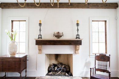 Example of a tuscan dark wood floor kitchen/dining room combo design in San Francisco with white walls