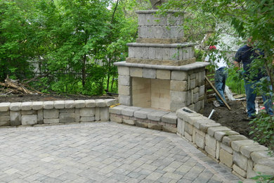 Inspiration for a country backyard patio in Minneapolis with a fire feature and concrete pavers.